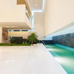 swimming pool at guest level… the water body is integrated into the ground floor living area.