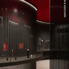 A view into the FIMA Store, where we used vertical steel partitions and a bold red ceiling to create an immersive, gallery-like experience. This design guides customers through a curated space, highlighting products with dramatic lighting and a strong color palette.