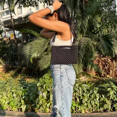 Meet our super versatile 3-way macrame bag, shown here as a shoulder bag. This is one of our favorite designs because it adapts to your needs, easily converting into a clutch or a cross-body sling. It's the perfect all-in-one accessory.
