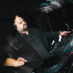 A motion-blur shot capturing the dynamic energy of a wedding DJ set. Even in a formal setting, the goal is always to create movement and excitement on the dance floor.