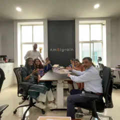 A happy moment in the studio with my team. We are gathered around a physical model, discussing the design and celebrating the collaborative process that brings our projects to life.