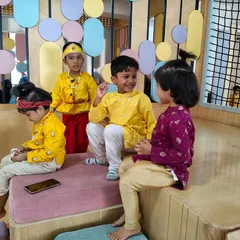 A quiet moment amidst the festivities, as our little Krishnas sit and chat together. Friendships blossom during these shared cultural experiences.