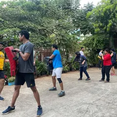 Starting the day strong with our morning outdoor batch. We take the training outside to work on kickboxing drills with pads and shields in the fresh air.
