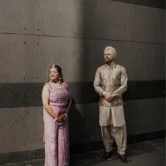 An artistic shot of Paramneet and Samuel, with a dramatic shadow creating a high-contrast, modern, and stylish portrait.
