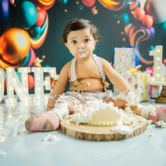 He's all in. This photo captures the hilarious and adorable mess of a successful cake smash. These are the fun-filled memories you'll look back on and smile.