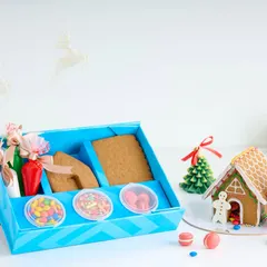 Our DIY Gingerbread House Kit is a fun and delicious activity for the whole family. The kit includes pre-baked gingerbread panels, icing, and all the candies you need to decorate.