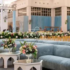 Comfortable and stylish corduroy lounge seating in a soft blue, arranged for guests to relax and socialize during the reception.