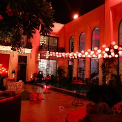 For the "Call Me Bae" series set, we transformed this courtyard into a vibrant evening space. A canopy of glowing lanterns and bold red lighting created an atmosphere that was both energetic and sophisticated, perfect for a high-end social scene.