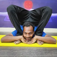 This advanced posture, Yoganidrasana (Yogic Sleep Pose), demonstrates the ultimate in hip and spine flexibility.