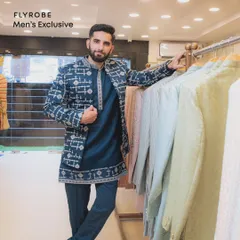 This blue printed bandi jacket, paired with a matching kurta and pants, is a great choice for a daytime event or mehendi. It's stylish, comfortable, and available to rent.