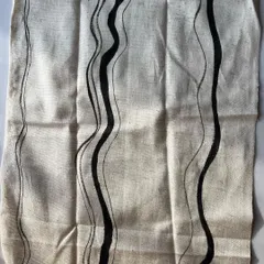 This is one of my favorite prints from the season, featuring hand-painted wavy lines on natural cotton. The organic, flowing design is created with a natural black pigment, perfect for modern and minimalist collections.