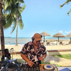 Another angle from the Tanzania beach gig, showing my professional Pioneer DJ setup against the ocean backdrop. I can bring a world-class sound experience anywhere.