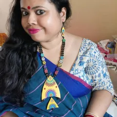 Here I am, wearing my hand-painted fish necklace. I love pairing my creations with my sarees to show how they can complete a look.