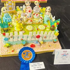 I poured my heart into this piece for the national Cakeology competition and was so proud to bring home the silver award. It’s a whimsical tea party with some of my favorite characters, and every tiny detail is sculpted from sugar.