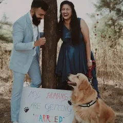A heartwarming and funny moment from a pre-wedding shoot, where the couple's dog announces their marriage. We love capturing your unique story.