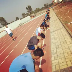 Our training extends beyond the squash court. Here, our athletes are lined up on the track for flying sprints, a key part of our program to build explosive speed and endurance.