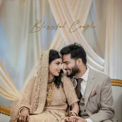'Blissful Couple'. A beautiful seated portrait from the Walima, capturing the couple's regal elegance and connection.