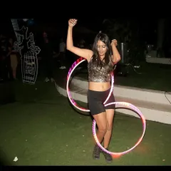 A double LED hoop performance at 46 Ounces. The vibrant colors of the hoops create a fun and playful atmosphere.