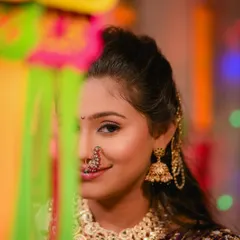 A beautiful close-up shot, perfect for the festive season, highlighting the intricate nath and choker necklace.