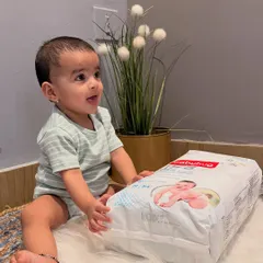 This is a static post from a collaboration with Firstcry for Babyhug Pro Diapers. I clearly list the product's key features like the Shea Butter layer and 12-hour LeakGuard, showing Gauri happily sitting with the product to create a positive association.