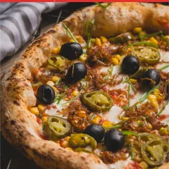 Our Classic Vegetarian pizza, loaded with corn, jalapeños, and olives, was recognized by 50 Top Pizza. It's a flavour explosion.