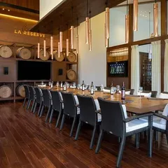 The 'Cave de la Reserve' offers a vintage masterpiece of an experience. The symphony of brick walls, wooden textures, and aging barrels creates a soulful ambiance for any wine tasting event.