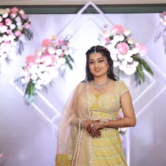 This soft pastel yellow lehenga is a beautiful and understated choice for a wedding guest. The delicate embroidery and pearl detailing on the blouse add a touch of elegance, making it suitable for daytime or evening events.