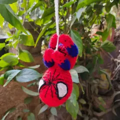 Your friendly neighborhood Spider-Man, in crochet form. This amigurumi hanging toy is perfect for decorating a kid's room or even a car mirror.