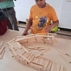 The focus in the room is always so real and inspiring. Each child gets their own set of planks and a space to bring their ideas to life, learning about balance and dedication through hands-on building.