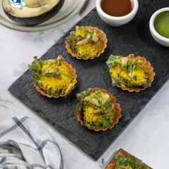 A gourmet twist on a street food favorite. Our Avocado Mousse Chaat in crisp phyllo cups is a perfect fusion appetizer for stylish weddings.