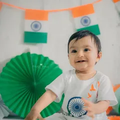 A beautiful, bright smile from a milestone session celebrating Independence Day. I love creating these festive setups with colorful props that bring out the happiest expressions from your child.