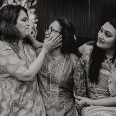 A beautiful, candid moment of affection between three generations of women. A tribute to the strength and love of mothers.