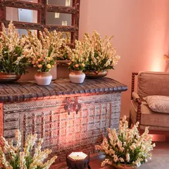 Another view of our Rajnigandha flower setup, placed on a rustic wooden chest to create an entrance console that is both beautiful and traditional.