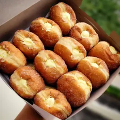 Getting ready for match day? A box of my classic custard-filled bombolinis is the perfect snack to share while you cheer on the team. They are light, fluffy, and filled with creamy, homemade vanilla custard.