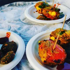 Plated tandoori appetizers, including paneer tikka and hara bhara kabab, served with chutneys. A perfect starter for any wedding party.