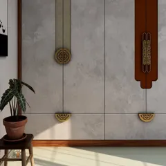 Another detail shot of the wardrobe, highlighting the intricate circular and semi-circular brass handles that contrast beautifully with the stone-finish doors.