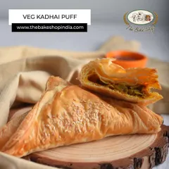 The Veg Kadhai Puff is a perfect evening snack. It has a flaky, buttery pastry filled with a spicy and flavorful vegetable mix.