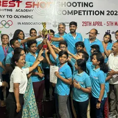 A moment of pure joy and team spirit as our shooters and I lift the championship trophy at the Best Shot Open Competition.