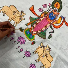 A work-in-progress shot of a beautiful Pichwai-style painting on fabric. I am carefully detailing Lord Shrinathji, surrounded by cows and lotuses, using a vibrant, traditional color palette.