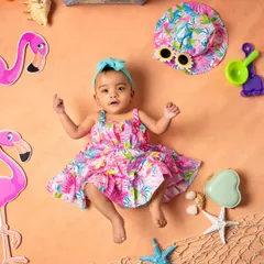 A full lay-flat view of our summer flamingo theme. This setup is perfect for younger infants, creating a colorful and playful scene around them.