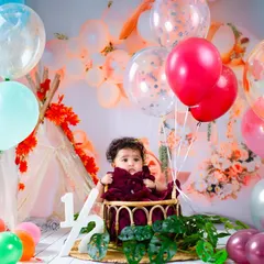 Halfway to one! This festive setup with a teepee and a colorful balloon arrangement is the perfect way to celebrate the six-month milestone.
