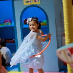 Hula hooping fun right outside the Tooney Cafe. Our space encourages kids to mix active play with imaginative scenarios.