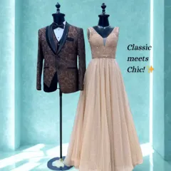 Classic meets chic with this pairing. A stunning beige gown with subtle sparkle is matched with a brown patterned tuxedo for a warm and elegant couple's look.