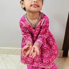 My adorable little client showing off her Diwali mehendi. It's moments like these that make my work so rewarding!