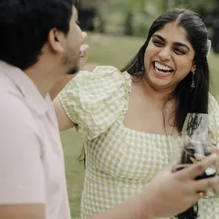 A moment of spontaneous laughter during a casual pre-wedding shoot. This image perfectly captures the couple's joyful and fun-loving personalities.