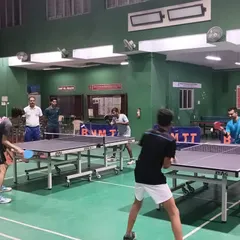 Here is a glimpse of our active training hall, featuring multiple simultaneous matches on our professional-grade Stag tables. We ensure a high-energy environment where players can engage in quality practice and competitive play on our cushioned, safe flooring.