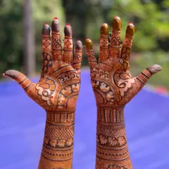 A classic full-arm bridal mehendi that showcases incredible detail from the fingertips to the elbows. I used a combination of fine lines, bold figures, and traditional patterns to create a rich and symmetrical look.