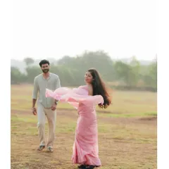A beautiful, candid shot of her twirling in her pink saree. The movement and joy in this image are what I strive to capture.
