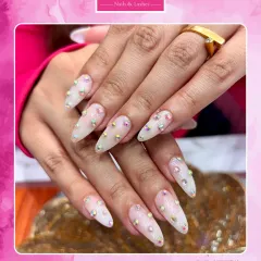 Ready for the spotlight? These long, stiletto nail extensions are adorned with iridescent stones for a look that is pure glamour. We use high-quality materials to ensure your extensions are as strong as they are stunning.