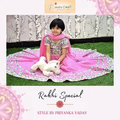 This bright pink cotton lehenga with a floral choli is a perfect Rakhi outfit. It's paired with a soft cotton dupatta, making it a comfortable and festive choice for a young girl. Image 26 shows another angle.